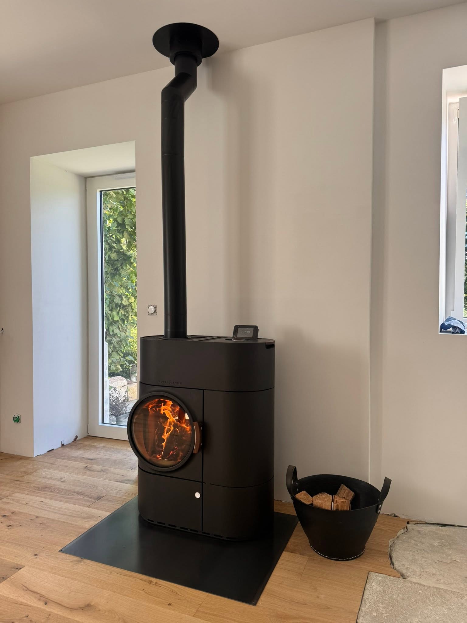 Un projet sur mesure avec le poêle mixte Austroflamm Clou Duo
